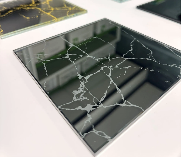 Decorative glass manufacture using a laser deletion process 