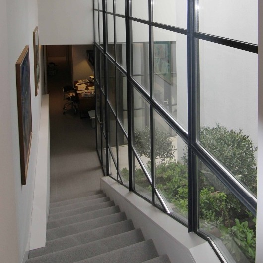 Metal windows allow light to flood new basement