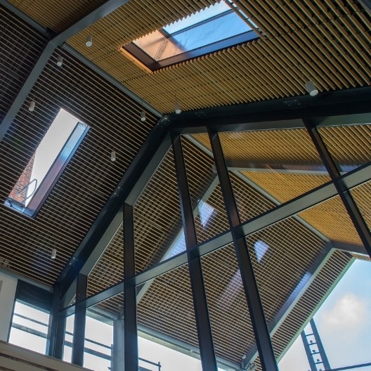 Wood grill ceiling adds design detail to £6m development